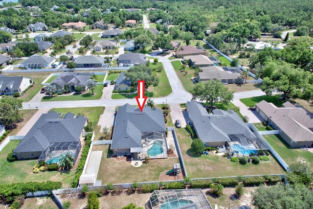 2032 Indian Sky Cir, Lakeland, FL 33813 - aerial view of property's location featuring a pool and nearby suburban area