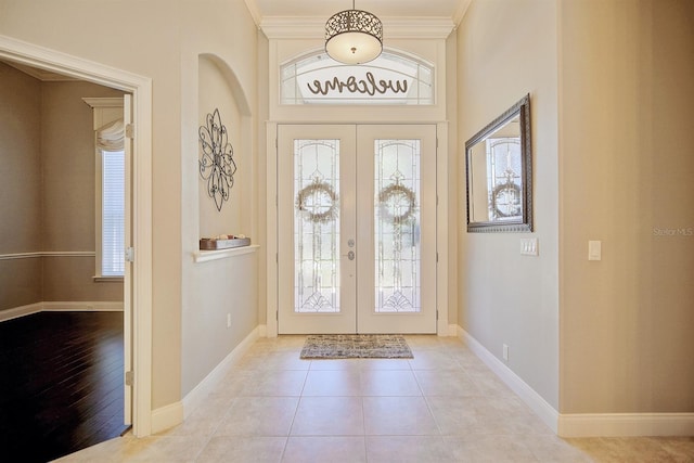 2032 Indian Sky Cir, Lakeland, FL 33813 - foyer featuring french doors, baseboards, and crown molding