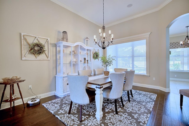 2032 Indian Sky Cir, Lakeland, FL 33813 - dining space with a chandelier, arched walkways, dark wood-type flooring, crown molding, and baseboards