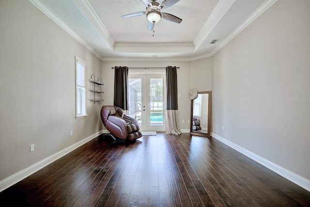 2032 Indian Sky Cir, Lakeland, FL 33813 - living area with a raised ceiling, french doors, a ceiling fan, dark wood-type flooring, and ornamental molding