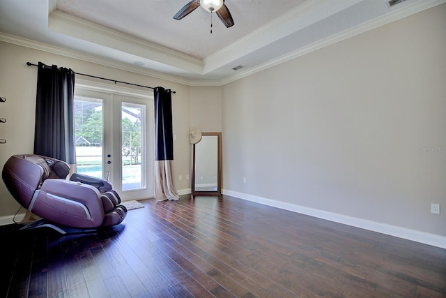 2032 Indian Sky Cir, Lakeland, FL 33813 - sitting room with a raised ceiling, ceiling fan, dark wood-style floors, baseboards, and crown molding
