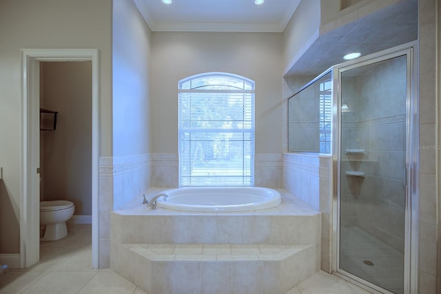 2032 Indian Sky Cir, Lakeland, FL 33813 - full bathroom featuring a shower stall, a garden tub, tile patterned flooring, toilet, and crown molding