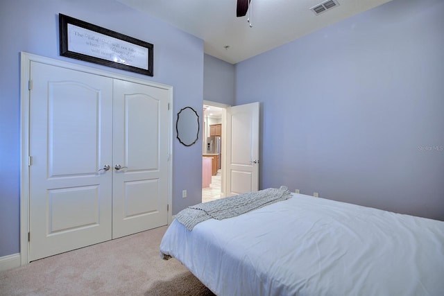 2032 Indian Sky Cir, Lakeland, FL 33813 - bedroom with light colored carpet, a closet, ceiling fan, and baseboards