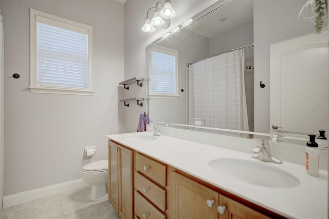 2032 Indian Sky Cir, Lakeland, FL 33813 - bathroom featuring toilet, tile patterned floors, double vanity, baseboards, and a shower with curtain