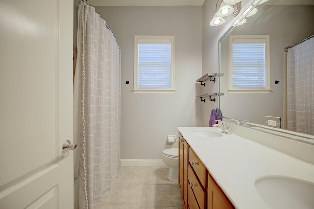2032 Indian Sky Cir, Lakeland, FL 33813 - bathroom with toilet, tile patterned flooring, double vanity, baseboards, and a shower with shower curtain