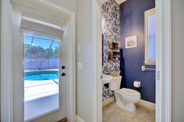 2032 Indian Sky Cir, Lakeland, FL 33813 - half bathroom featuring baseboards, toilet, and tile patterned floors