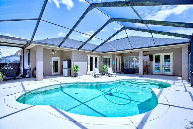2032 Indian Sky Cir, Lakeland, FL 33813 - outdoor pool featuring french doors, ceiling fan, and a patio area