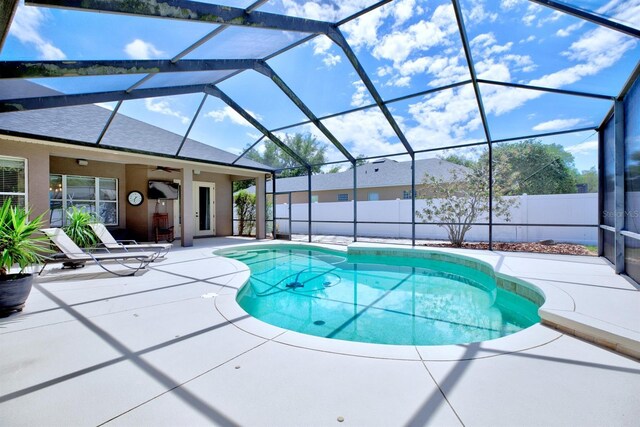 2032 Indian Sky Cir, Lakeland, FL 33813 - view of swimming pool with a patio, ceiling fan, fence, and a lanai