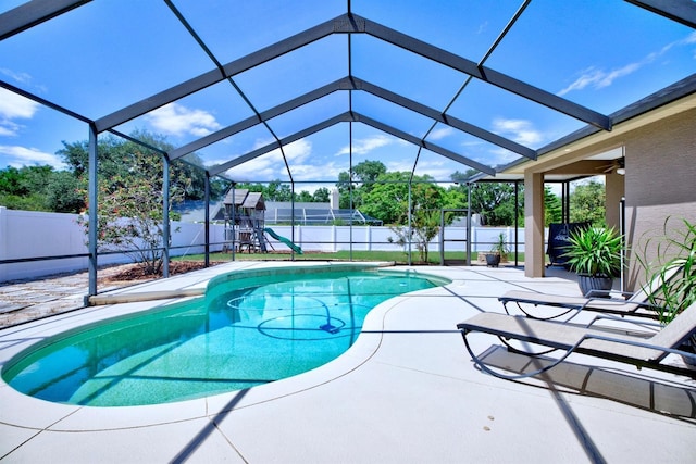 2032 Indian Sky Cir, Lakeland, FL 33813 - view of pool featuring a fenced backyard, a patio, glass enclosure, and a playground