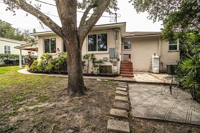 2710 Fairmount Ave, Lakeland, FL 33803 - back of house with central AC unit and a patio area