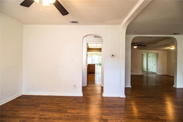 2710 Fairmount Ave, Lakeland, FL 33803 - empty room with ceiling fan, arched walkways, wood finished floors, and baseboards