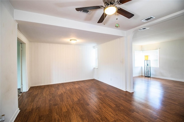 2710 Fairmount Ave, Lakeland, FL 33803 - unfurnished room featuring wood finished floors, arched walkways, a ceiling fan, and baseboards