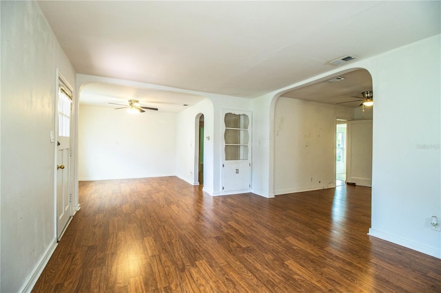 2710 Fairmount Ave, Lakeland, FL 33803 - spare room with ceiling fan, arched walkways, wood finished floors, and healthy amount of natural light