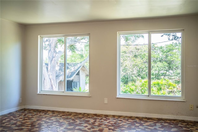 2710 Fairmount Ave, Lakeland, FL 33803 - spare room with plenty of natural light and baseboards