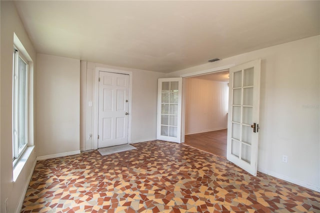 2710 Fairmount Ave, Lakeland, FL 33803 - unfurnished room with french doors and baseboards