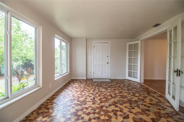 2710 Fairmount Ave, Lakeland, FL 33803 - empty room featuring french doors and baseboards