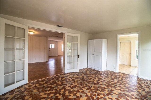 2710 Fairmount Ave, Lakeland, FL 33803 - empty room featuring french doors, wood finished floors, and baseboards