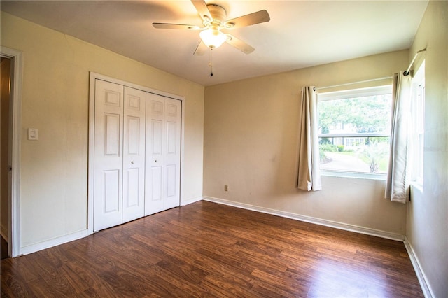 2710 Fairmount Ave, Lakeland, FL 33803 - unfurnished bedroom with dark wood finished floors, baseboards, and a closet