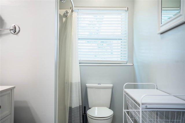 2710 Fairmount Ave, Lakeland, FL 33803 - bathroom featuring vanity, toilet, and a shower with shower curtain