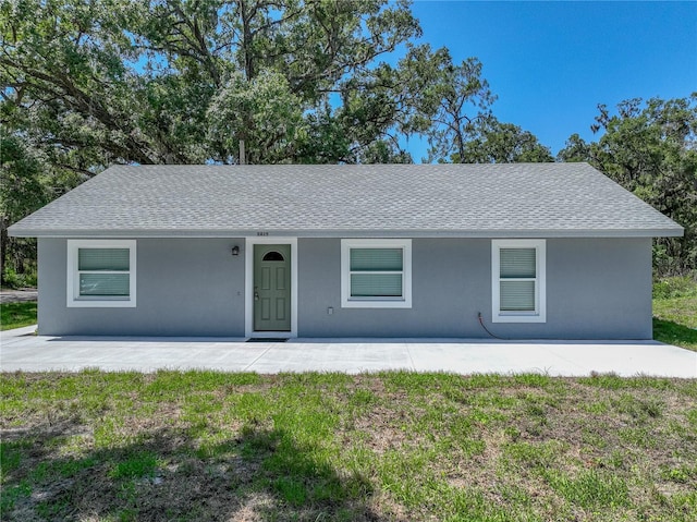 1415 Southern Ave, Lakeland, FL 33803 - ranch-style home featuring a shingled roof and stucco siding