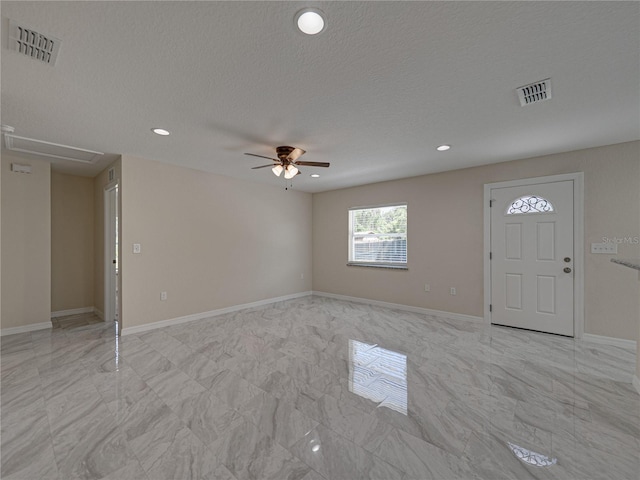 1415 Southern Ave, Lakeland, FL 33803 - entryway featuring light marble finish flooring, ceiling fan, recessed lighting, baseboards, and a textured ceiling
