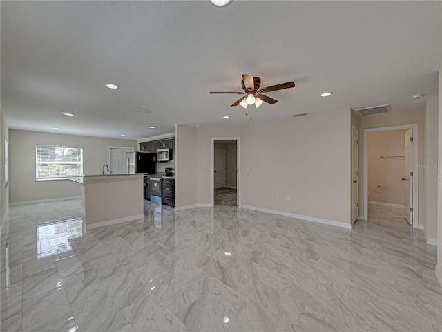1415 Southern Ave, Lakeland, FL 33803 - unfurnished living room featuring light marble finish floors, ceiling fan, recessed lighting, and baseboards