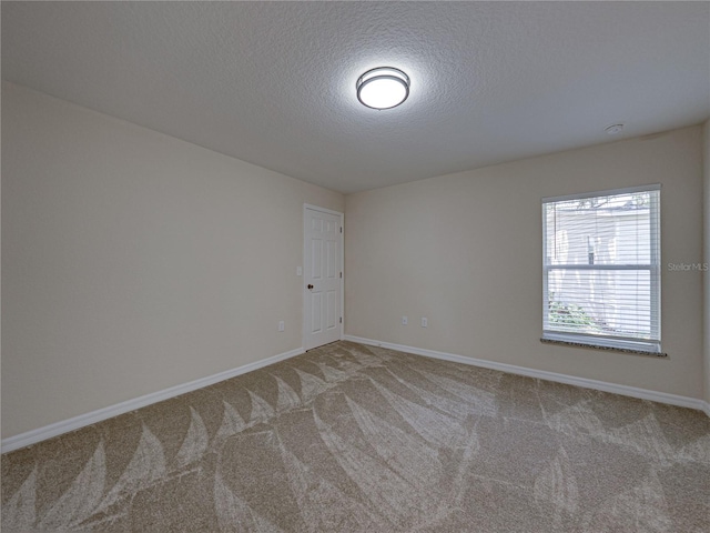 1415 Southern Ave, Lakeland, FL 33803 - carpeted spare room featuring baseboards and a textured ceiling