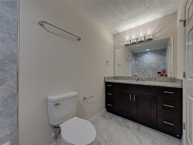 1415 Southern Ave, Lakeland, FL 33803 - full bath with marble finish floors, toilet, a textured ceiling, vanity, and a shower