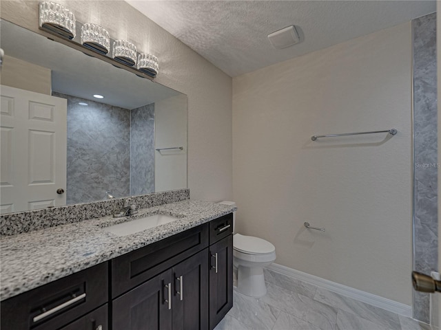 1415 Southern Ave, Lakeland, FL 33803 - bathroom featuring toilet, baseboards, vanity, marble look tiles, and a textured ceiling