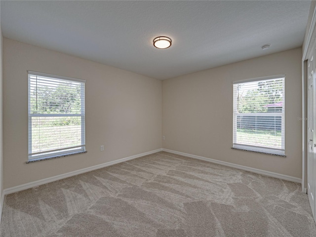 1415 Southern Ave, Lakeland, FL 33803 - empty room featuring light carpet and baseboards