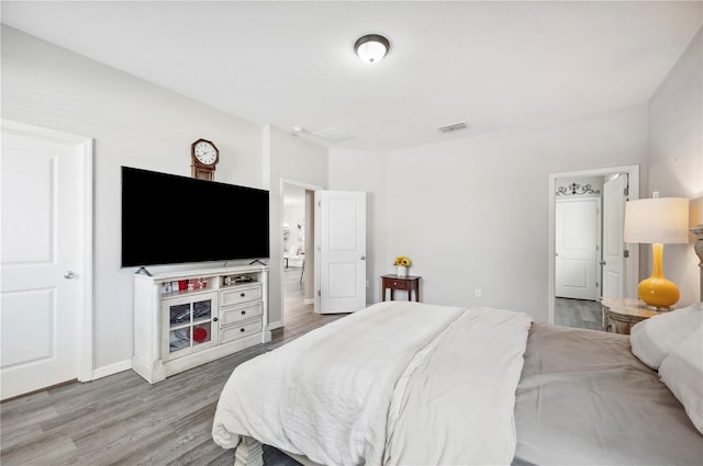 4303 Moon Shadow Loop, Mulberry, FL 33860 - bedroom with wood finished floors and baseboards
