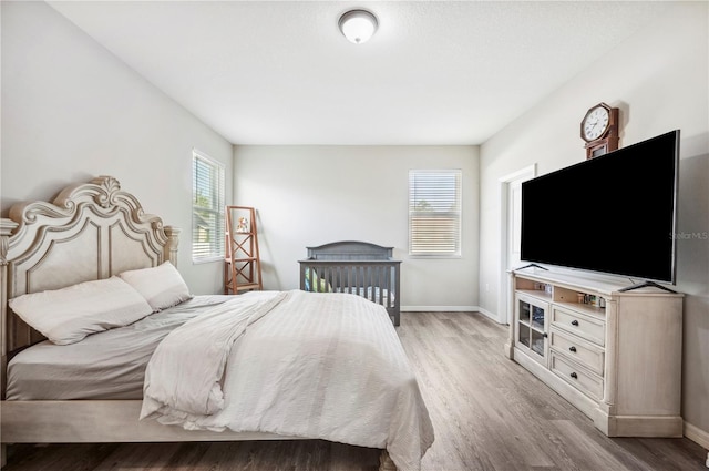 4303 Moon Shadow Loop, Mulberry, FL 33860 - bedroom featuring light wood finished floors and baseboards