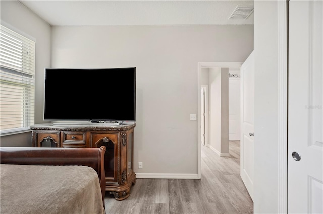 4303 Moon Shadow Loop, Mulberry, FL 33860 - bedroom with wood finished floors and baseboards