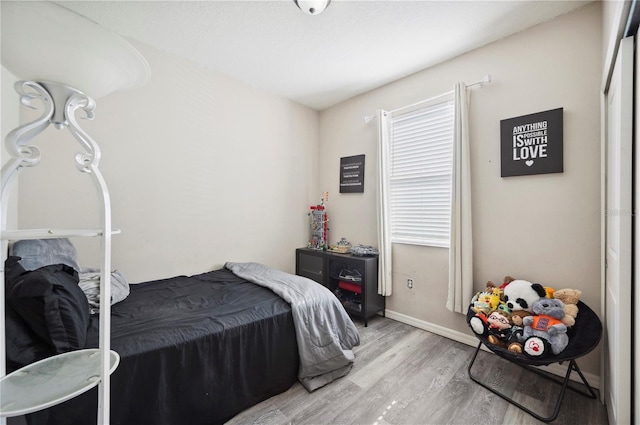 4303 Moon Shadow Loop, Mulberry, FL 33860 - bedroom featuring wood finished floors and baseboards