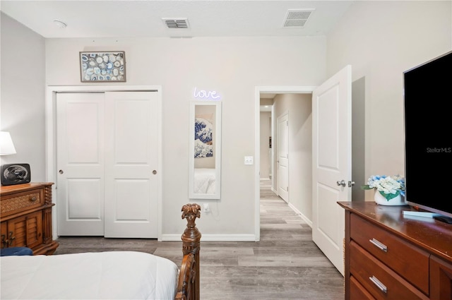 4303 Moon Shadow Loop, Mulberry, FL 33860 - bedroom featuring light wood-type flooring, a closet, and baseboards