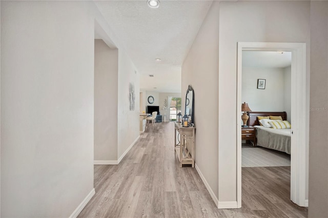 4303 Moon Shadow Loop, Mulberry, FL 33860 - hall with light wood finished floors and baseboards