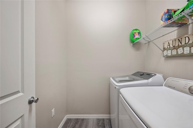 4303 Moon Shadow Loop, Mulberry, FL 33860 - laundry room with independent washer and dryer, wood finished floors, and baseboards
