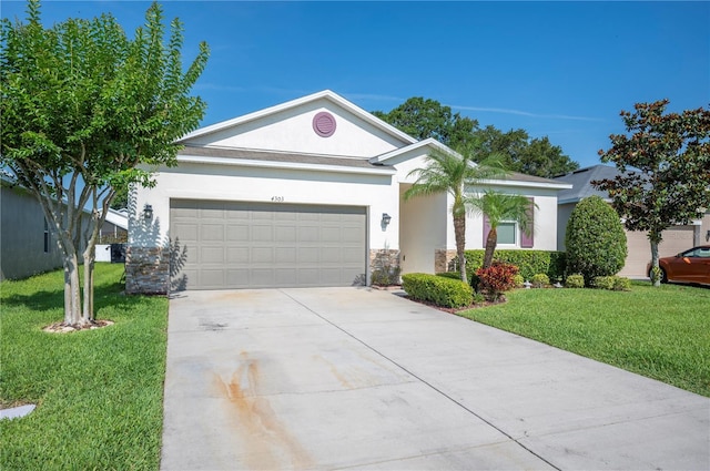 4303 Moon Shadow Loop, Mulberry, FL 33860 - ranch-style house with stucco siding, an attached garage, a front lawn, and concrete driveway