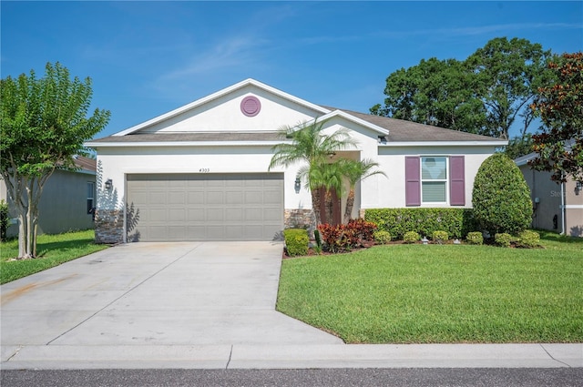 4303 Moon Shadow Loop, Mulberry, FL 33860 - single story home featuring an attached garage, a front lawn, driveway, and stucco siding