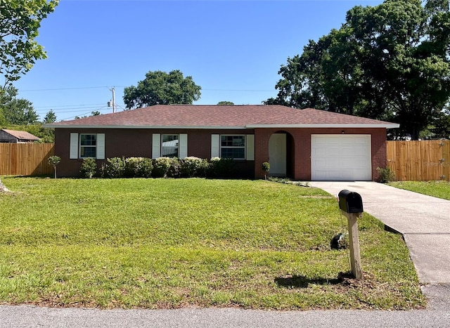 2323 Ridgeview Dr, Lakeland, FL 33810 - ranch-style home with concrete driveway, an attached garage, brick siding, and roof with shingles