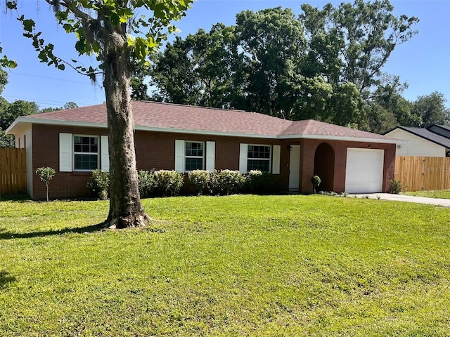2323 Ridgeview Dr, Lakeland, FL 33810 - ranch-style home featuring an attached garage, brick siding, concrete driveway, and roof with shingles