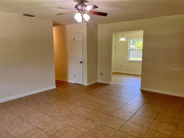 2323 Ridgeview Dr, Lakeland, FL 33810 - empty room featuring ceiling fan and light tile patterned floors