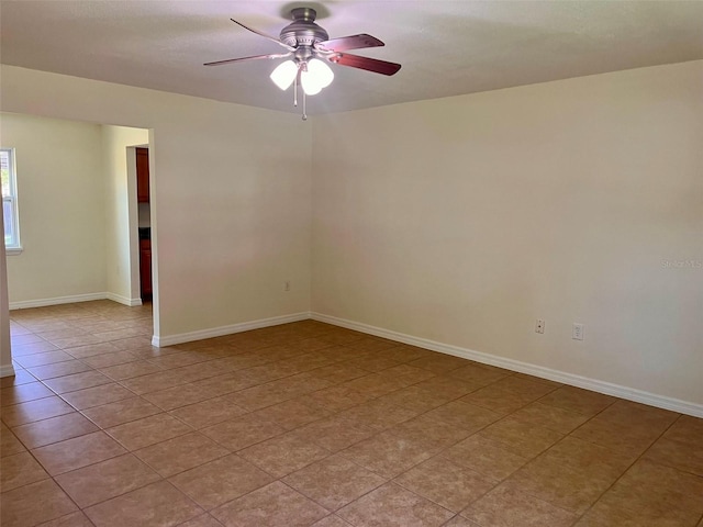 2323 Ridgeview Dr, Lakeland, FL 33810 - spare room with a ceiling fan, light tile patterned floors, and baseboards