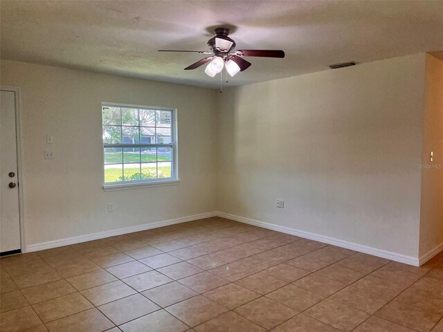 2323 Ridgeview Dr, Lakeland, FL 33810 - unfurnished room featuring ceiling fan, light tile patterned flooring, and baseboards