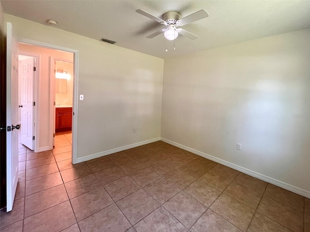 2323 Ridgeview Dr, Lakeland, FL 33810 - unfurnished room with a ceiling fan, baseboards, a smoke detector, and light tile patterned flooring