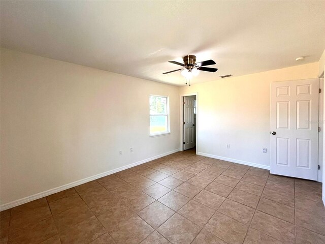 2323 Ridgeview Dr, Lakeland, FL 33810 - unfurnished room featuring baseboards, tile patterned flooring, and ceiling fan