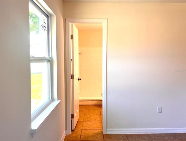 2323 Ridgeview Dr, Lakeland, FL 33810 - corridor featuring light tile patterned flooring and baseboards