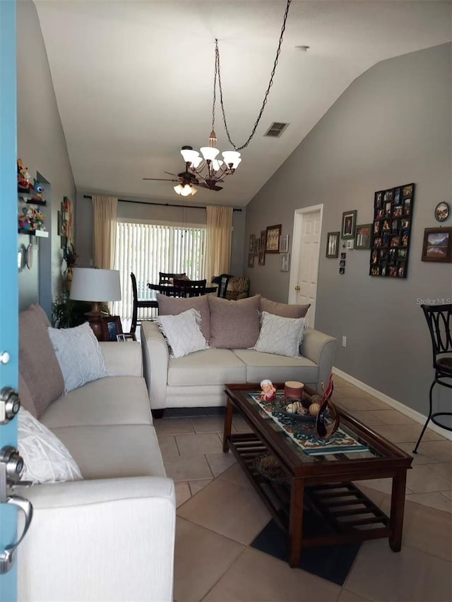 455 Eagle Dr, Kissimmee, FL 34759 - tiled living area featuring vaulted ceiling, a chandelier, ceiling fan, and baseboards