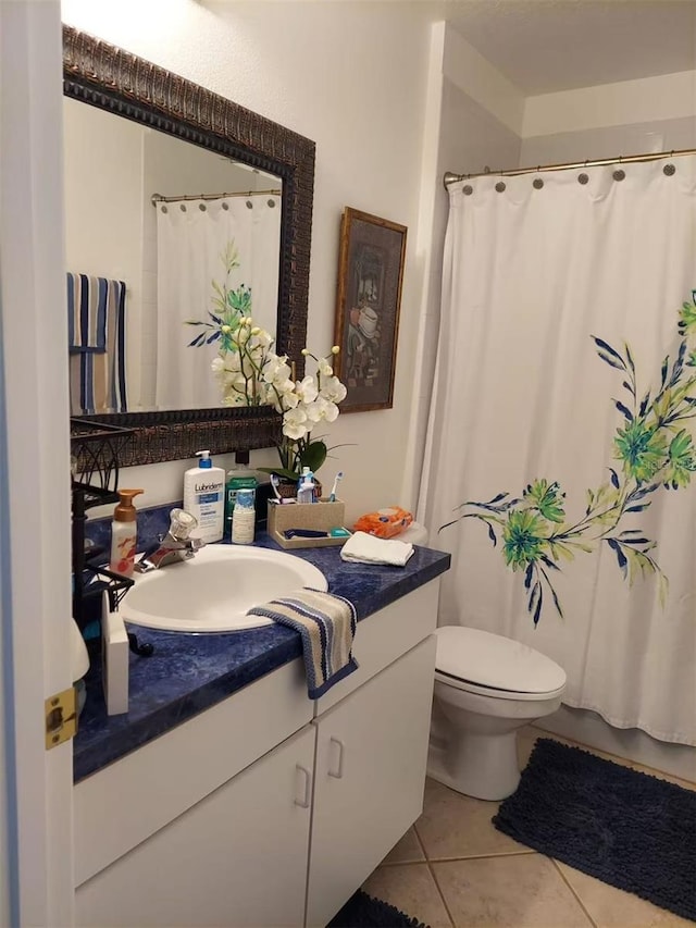 455 Eagle Dr, Kissimmee, FL 34759 - full bathroom with tile patterned flooring, vanity, toilet, and curtained shower
