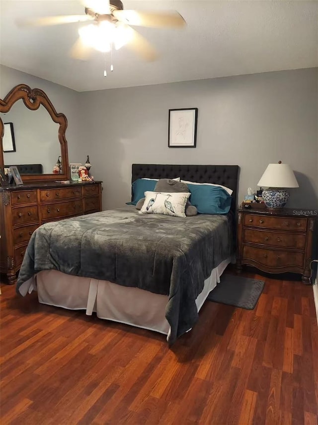 455 Eagle Dr, Kissimmee, FL 34759 - bedroom with dark wood-style floors and a ceiling fan